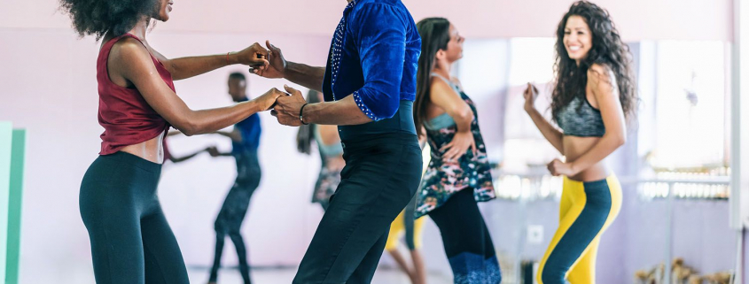 Couples learning how to salsa dance