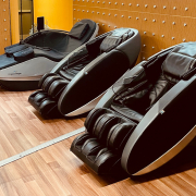 Photo of 2 massage chairs and cryotherapy bed