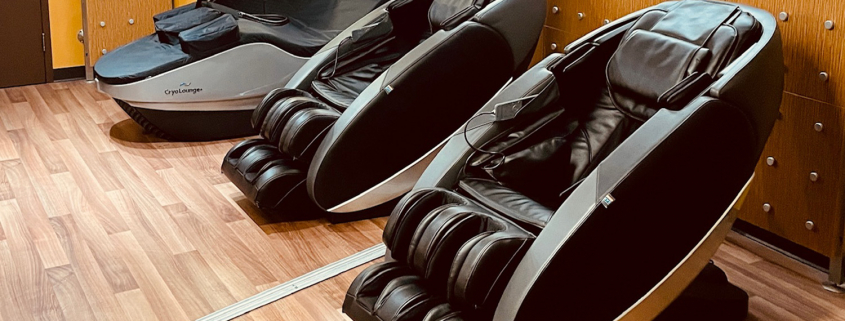 Photo of 2 massage chairs and cryotherapy bed