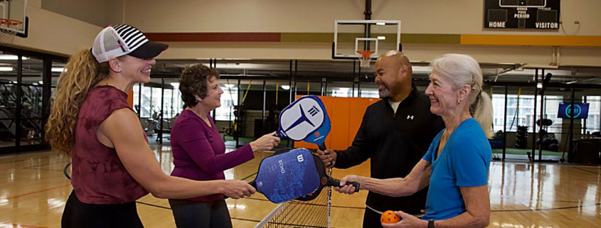 members playing pickleball at EH