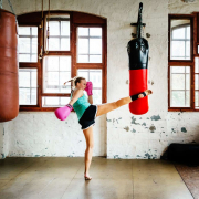 A women practicing kickboxing in a gym