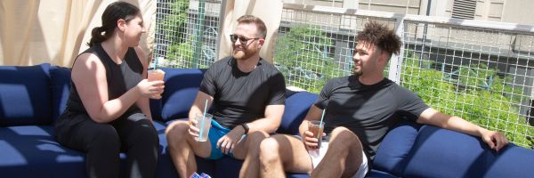 members with drinks at the outdoor pool at the best gym in chicago