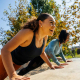 Two women participating in an outdoor workout