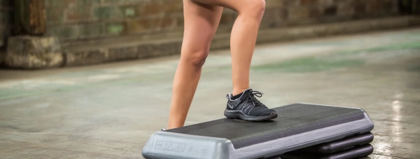 A women doing a step class