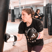 Woman punching a punching bag at Chicago's best gym