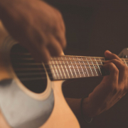 A person playing the guitar
