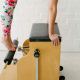 A women doing pilates on a Wunda Chair
