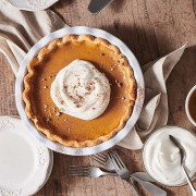 A pumpkin pie on a table