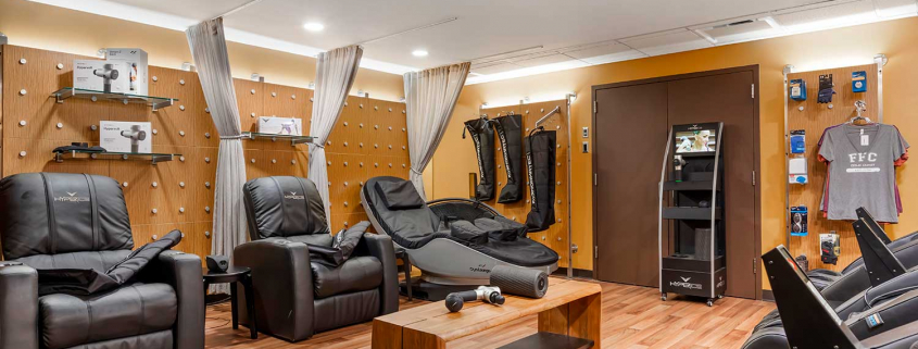Recovery lounge with massage chairs and cryo chairs inside FFC Gold Coast Gym.