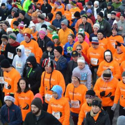 A group of runners participating in a turkey trot
