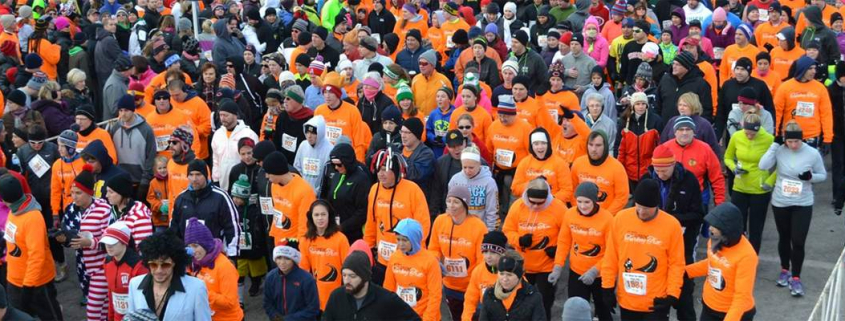 A group of runners participating in a turkey trot
