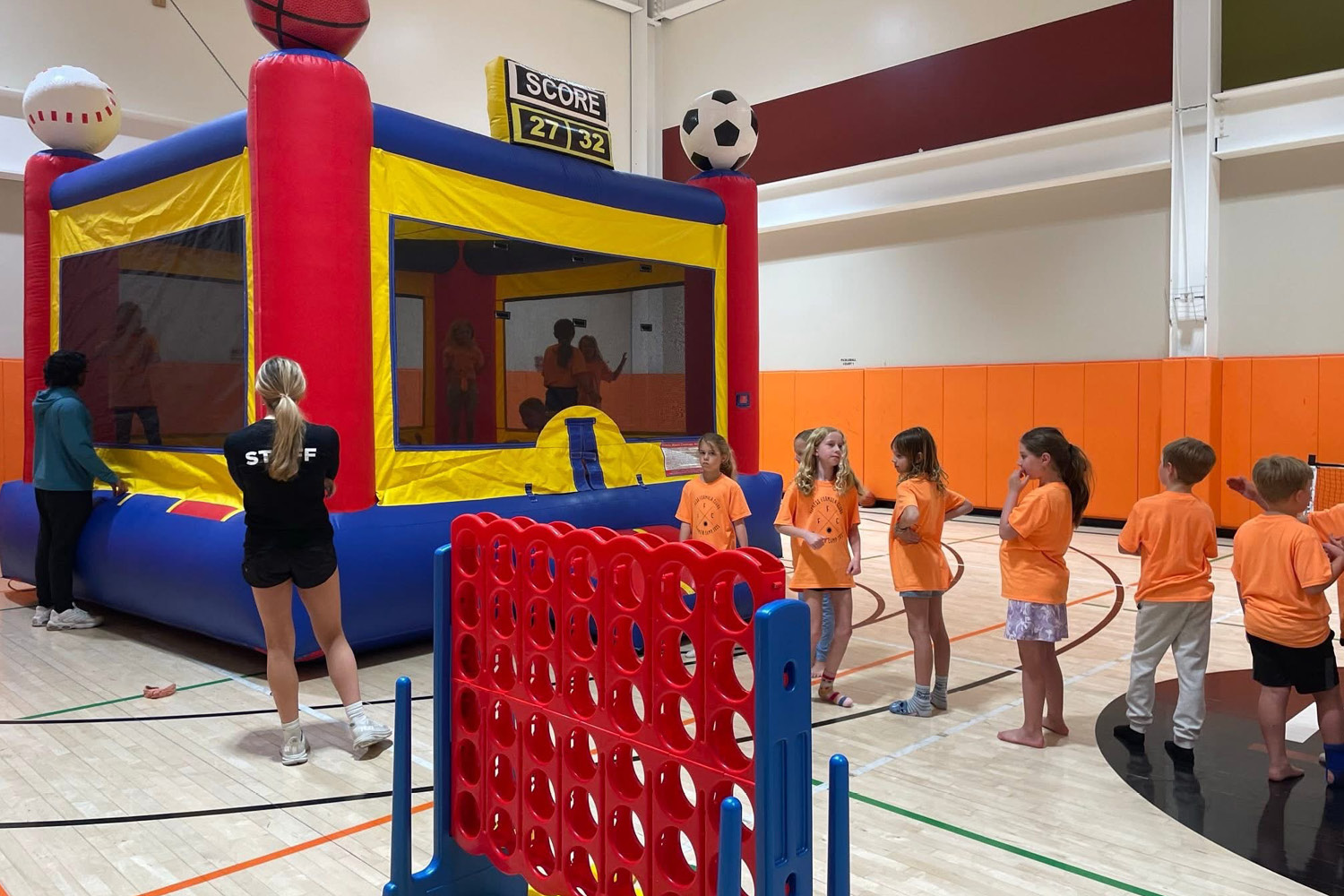 Kids club at FFC Park Ridge. Kids waiting in line for the bouncy house